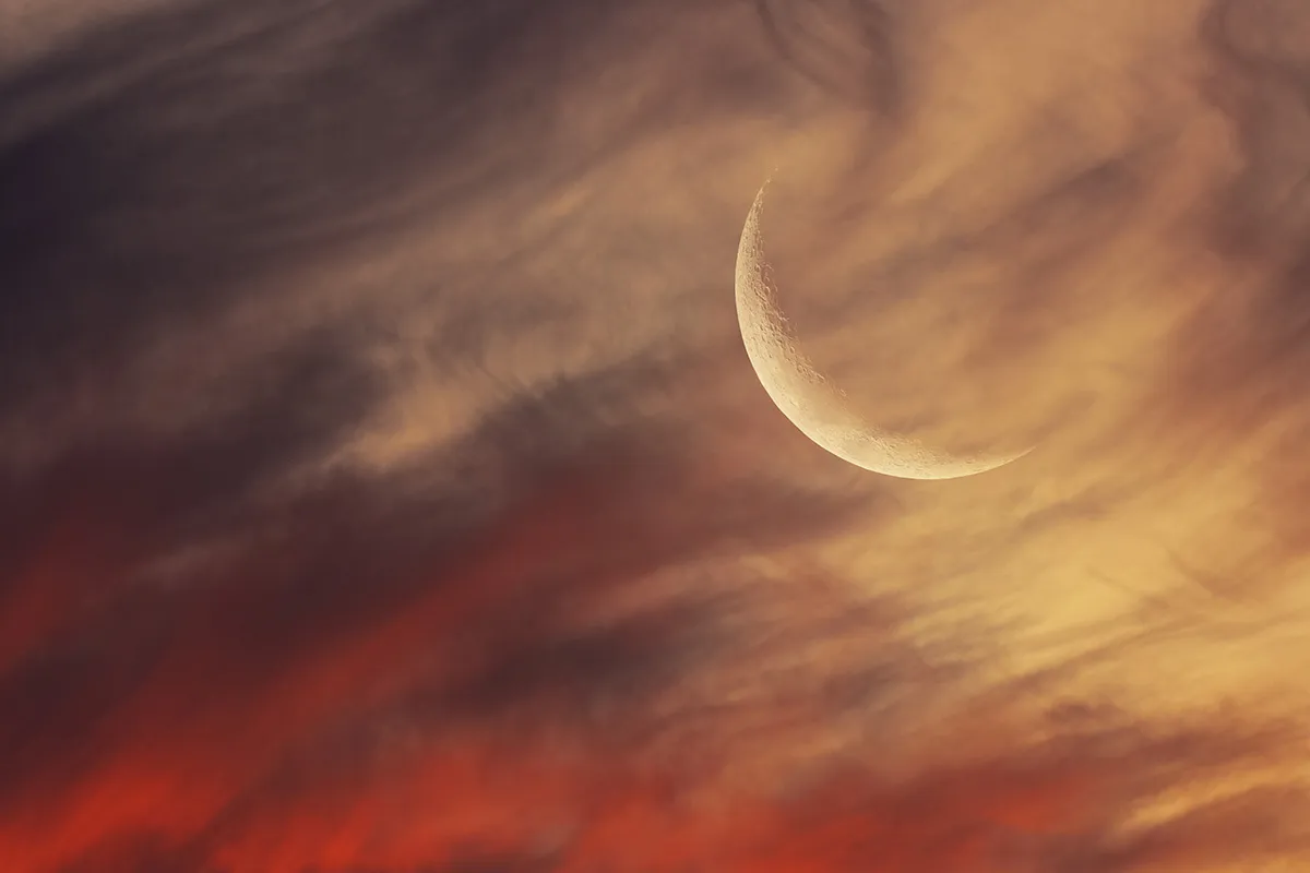 Crescent Moon in a Magical Sunset, by Eduardo Schaberger Poupeau, Rafaela, Santa Fe, Argentina Category: Our Moon Equipment: Canon EOS 90D camera, 600 mm f/6.3, ISO 800, three exposures between 1/400 and 1/100-seconds