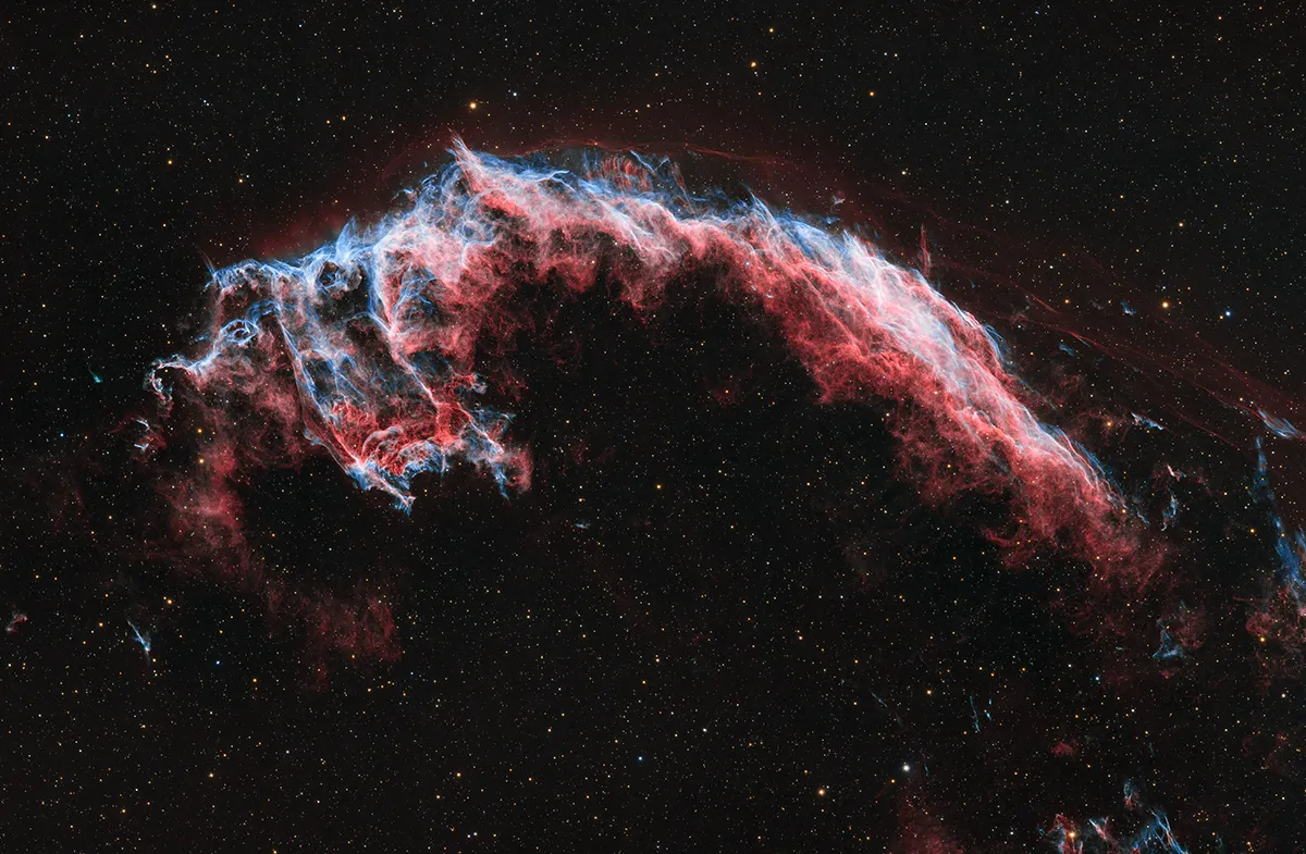 Eastern Veil: NGC6992/6995, by Jia You, Jiuliancheng town, Hebei Province, China Category: The Sir Patrick Moore Prize for Best Newcomer Equipment: Sky Rover 102APO telescope, Antlia 3nm filter, Sky-Watcher EQ6 Pro mount, ZWO-ASI2600MM-Cool camera, Gain 100, 714 mm f/7, 30 x 900-second (H-alpha x 20, OIII x 10) exposures