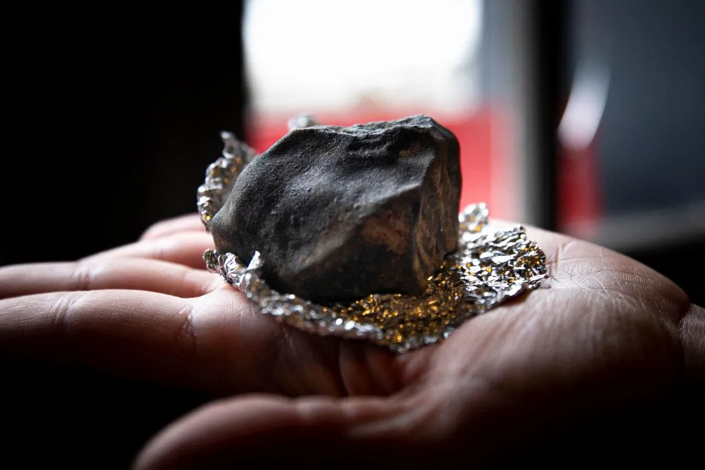 A meteorite from asteroid 2023 CX1 found on 15 February 2023, near Dieppe in Angiens, northwestern France. Photo by Lou BENOIST / AFP) (Photo by LOU BENOIST/AFP via Getty Images