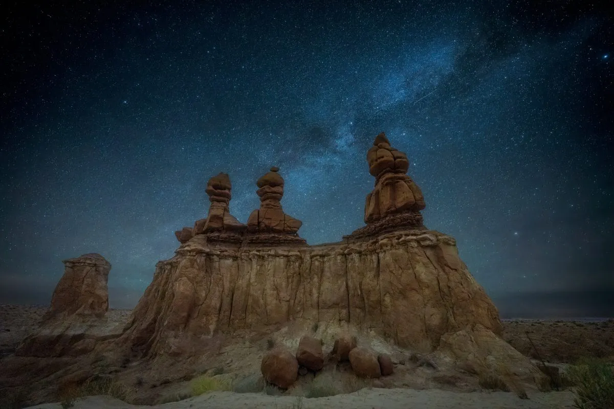 The Milky Way over The Three Sisters hoodoo, Goblin Valley State Park, Utah. Credit: Diana Robinson Photography / Getty