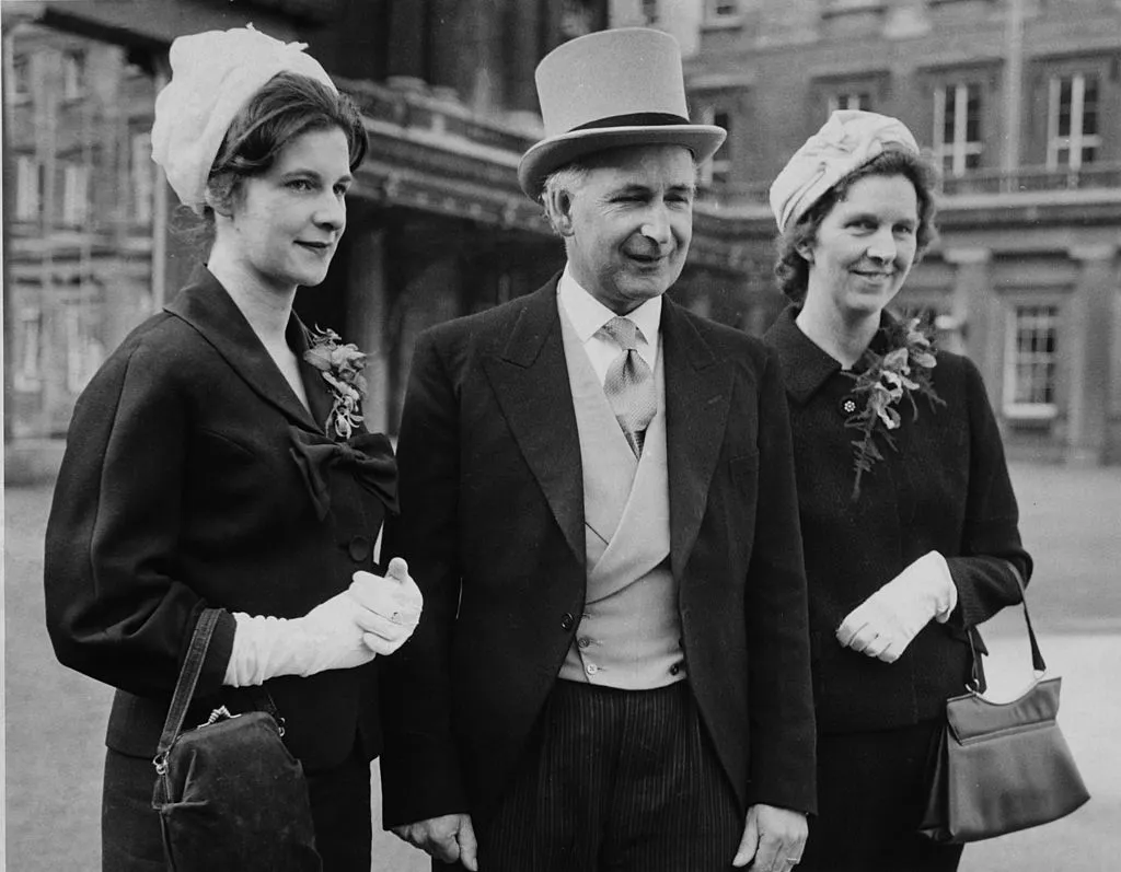 Bernard Lovell with his wife and daughter at Buckingham Palace before receiving his Knighthood, London, 7 February 1961. Photo by Evening Standard/Hulton Archive/Getty Images