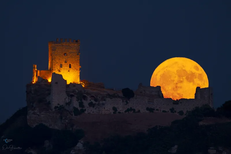 The Sturgeon Super Moon Above The Walls of Cefalà Diana Castle, Sicily, captured by Dario Giannobile, 1 August 2023. Equipment: Canon EOS 7D DSLR camera, Sigma 150-600mm lens @ 900mm.
