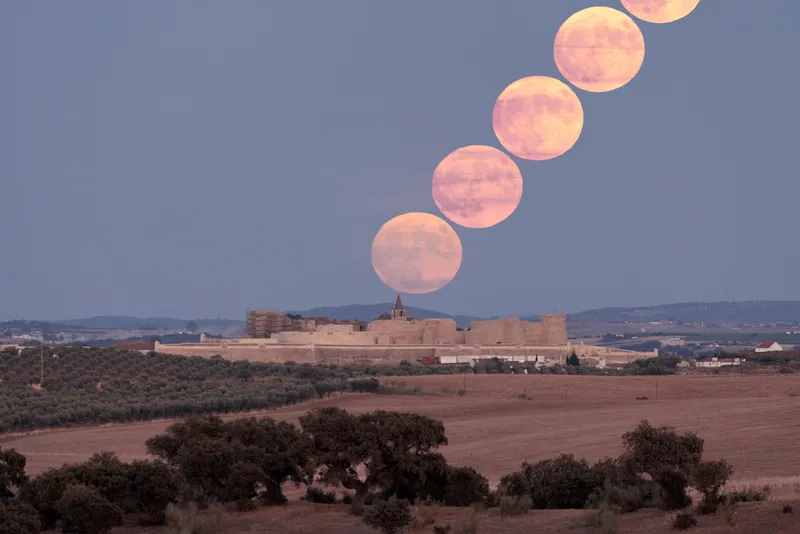 Sérgio Conceição captured this image of the Super Blue Moon over the Juromenha Fortress in Alentejo, Portugal, 30 August 2023. The time-lapse image was created with a separation of 2.5 minutes. Images were captured at 8:13 pm in Portugal. Equipment: Canon EOS R DSLR camera, 400mm lens. Exposure: 1/60, 1/50, 1/40, f/5.6, ISO 400