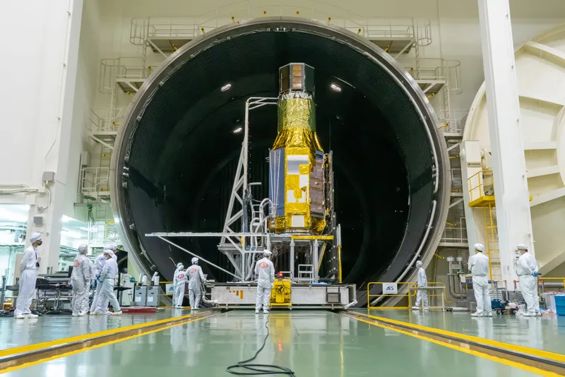 The XRISM spacecraft in a space environment test room at the JAXA Tsukuba Space Center, August 2022. The chamber simulates the temperatures and vacuum the spacecraft will encounter in space. Credit: JAXA