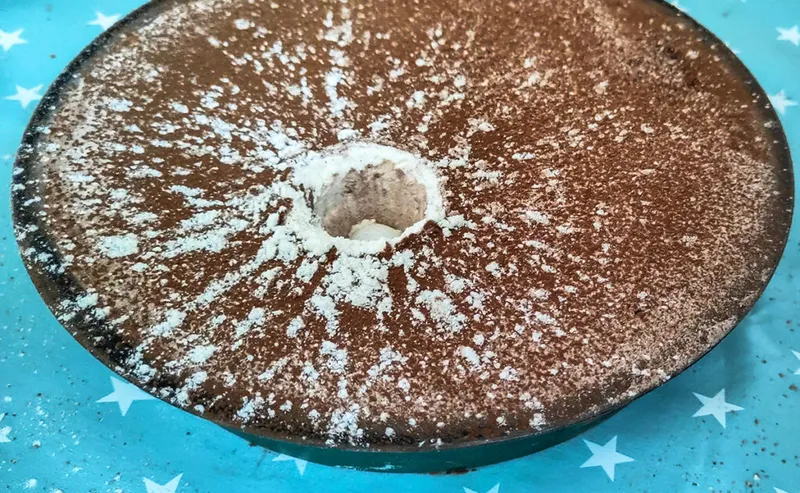 When making a Moon crater, the underlying white flour shows up well against the darker cocoa powder surface. Credit: Mary McIntyre