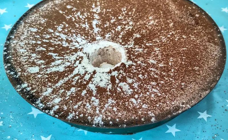 When making a Moon crater, the underlying white flour shows up well against the darker cocoa powder surface. Credit: Mary McIntyre