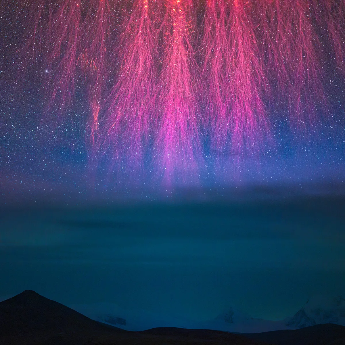 Grand Cosmic Fireworks © Angel An. Location: Lake Puma Yumco, Tibet, China. Winner, Skyscapes category. Taken with a Sony ILCE-7S3 camera, 135 mm f/1.8, ISO 12800, 4-second exposure