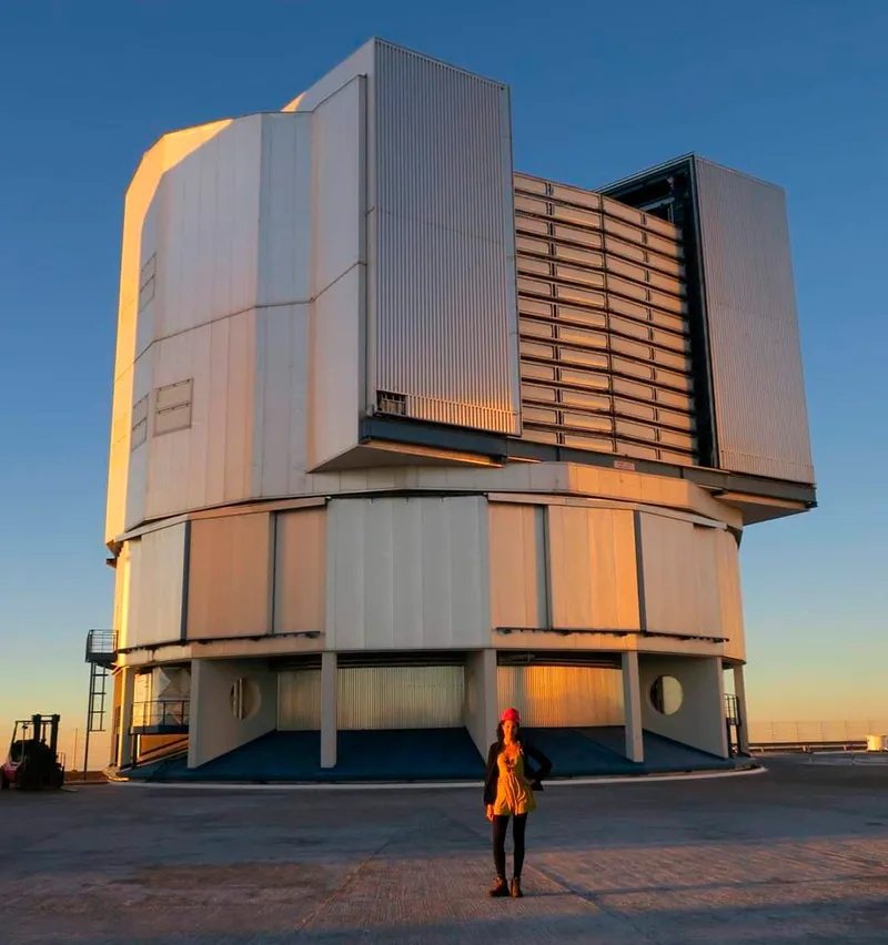 Telescope operator Abigail Frost outside the Paranal Observatory, which sits above a Martian-like, rusty-red desert landscape in northern Chile.