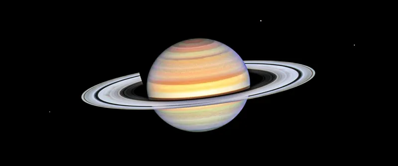 Image of Saturn captured by the Hubble Space Telescope showing its pastel-coloured bands and grey rings. Credit: NASA, ESA, STScI, Amy Simon (NASA-GSFC)
