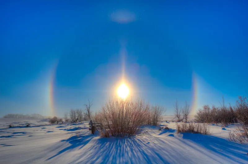 Sun dogs and a solar halo around the Sun in Alberta, Canada. Credit: Alan Dyer/Stocktrek Images/Getty Images