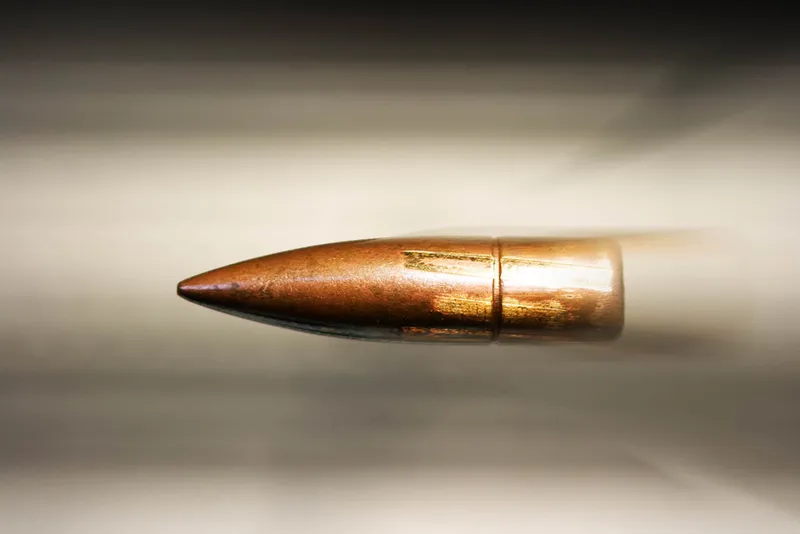 On Earth, a fired bullet is on a trajectory towards the ground, due to gravity. Credit: Ejla / Getty Images