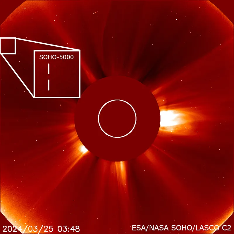 A SOHO image showing the 5,000th confirmed comet discovered by the observatory. The large circle in the centre is a coronagraph, which obscures the main solar disc, allowing scientists to observe prominences and other phenomena emanating from the Sun's outer layer. Credit: NASA/ESA SOHO