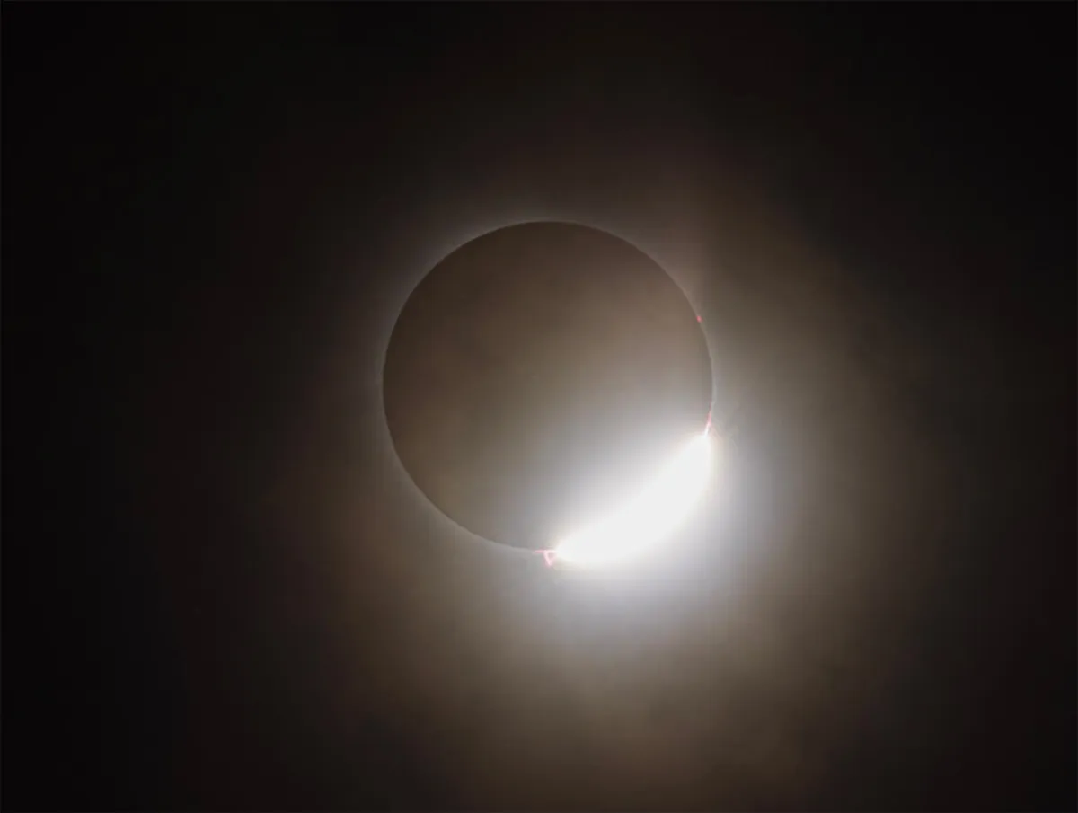 Diamond ring with prominences during the April 8 total solar eclipse, captured by Sonali Deshmukh, Greenwood, Indiana, USA, with a Canon R6 camera, 400mm lens, f8, ISO 160, 1/1000s