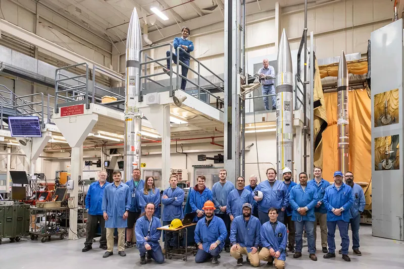 The three APEP sounding rockets and the support team. Team lead Aroh Barjatya is at the top centre on the raised platform. Credit: NASA/Berit Bland