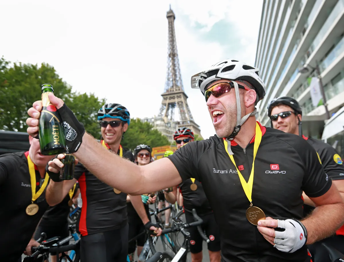 Riders celebrate completing Hot Chilee's London-Paris ride in 2017