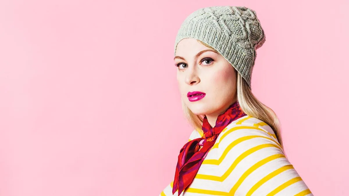 Model wearing knitted kate gagnon osborn baby jane hat