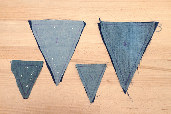 Cutting out the denim triangles