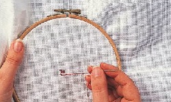 How to use an embroidery hoop for cross stitch step 3