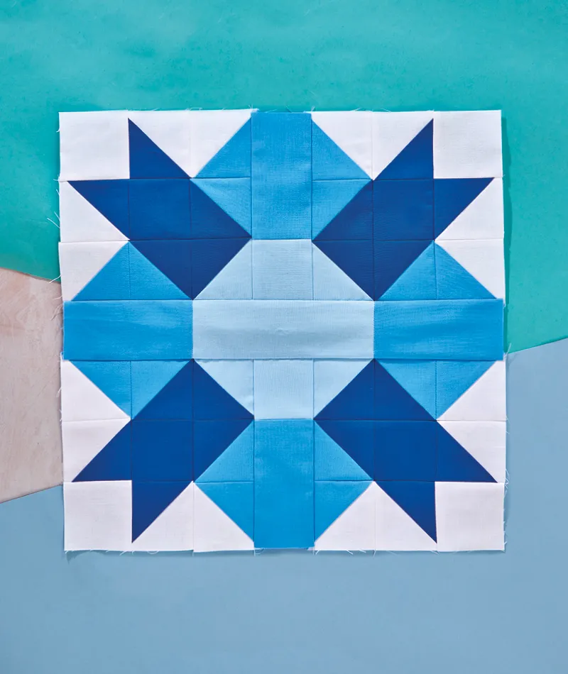Modern Bear Paw quilt block: blue tones