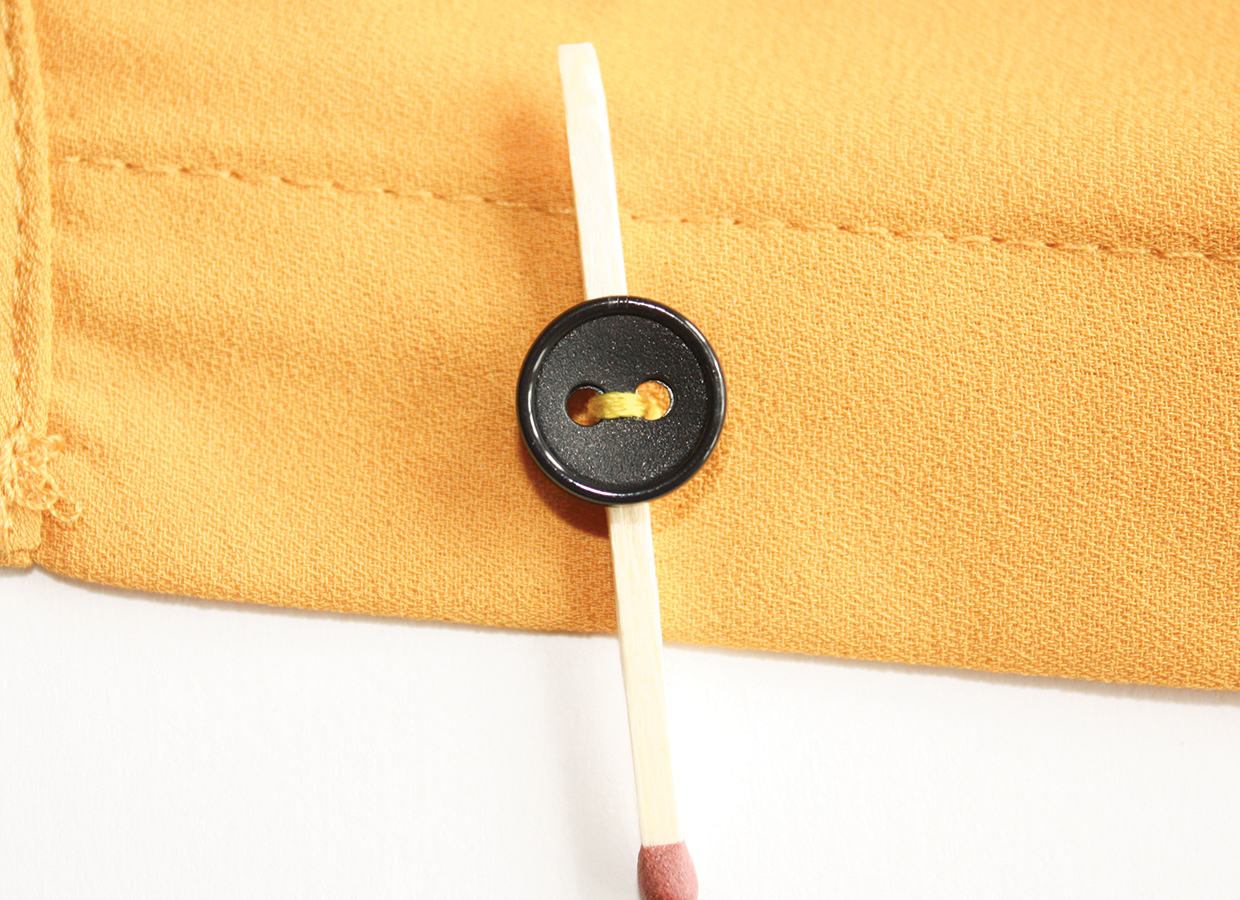 How to sew a button step 2