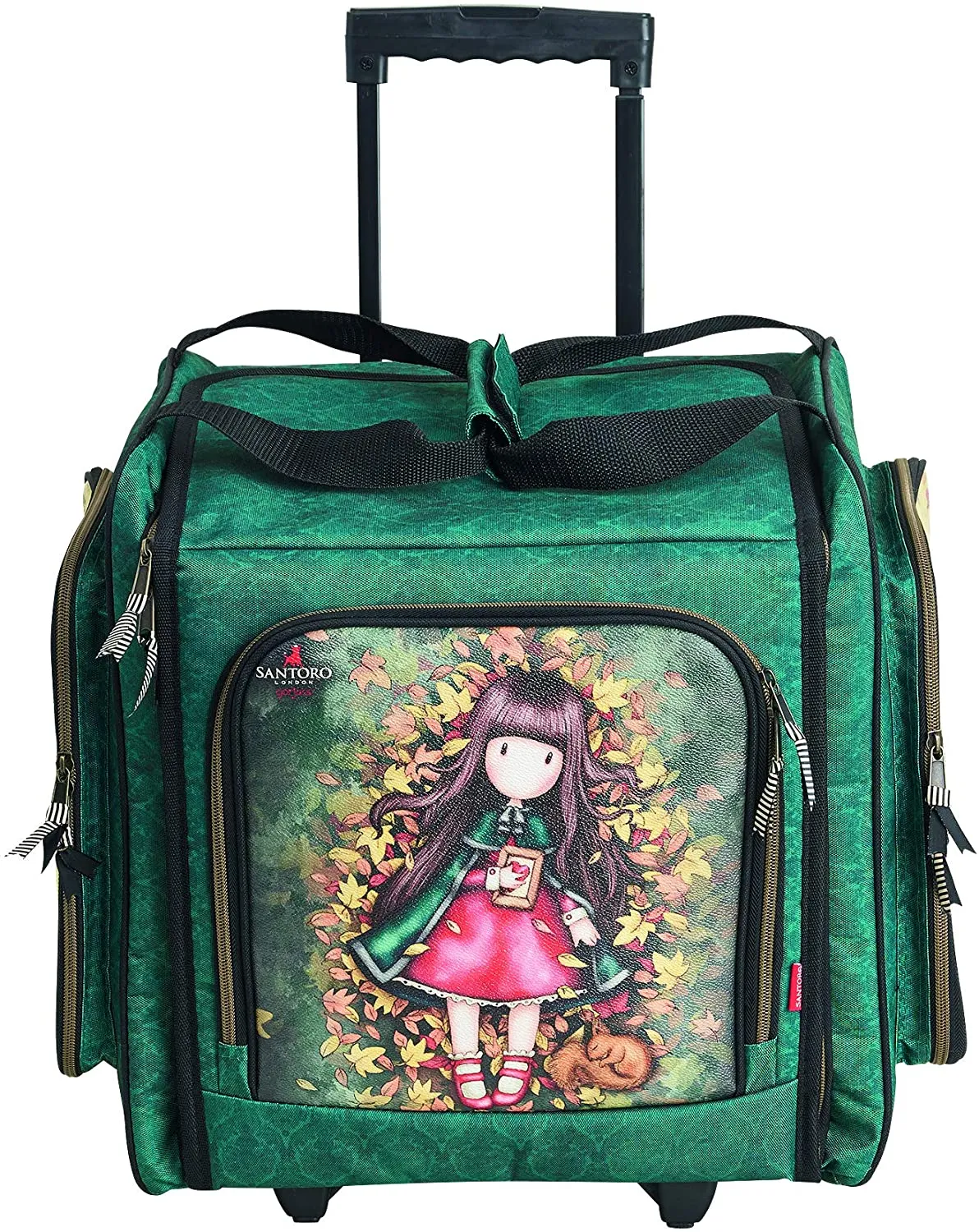 The knitting bag from Santora is made of green fabric with Gorjuss printed on it standing amid fallen leaves