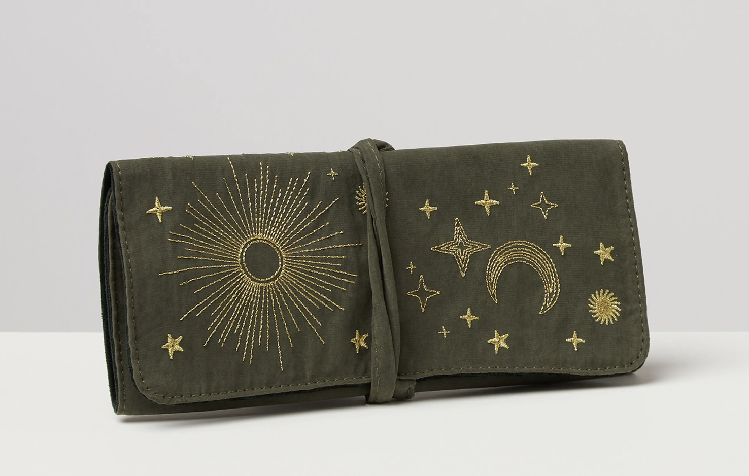 Embroidered star khaki jewellery roll from Oliver Bonas