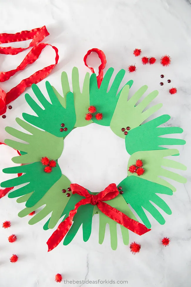 https://c02.purpledshub.com/uploads/sites/51/2020/10/Christmas-Crafts-for-Kids-Handprint-wreath-7de53d8.jpg?webp=1&w=1200