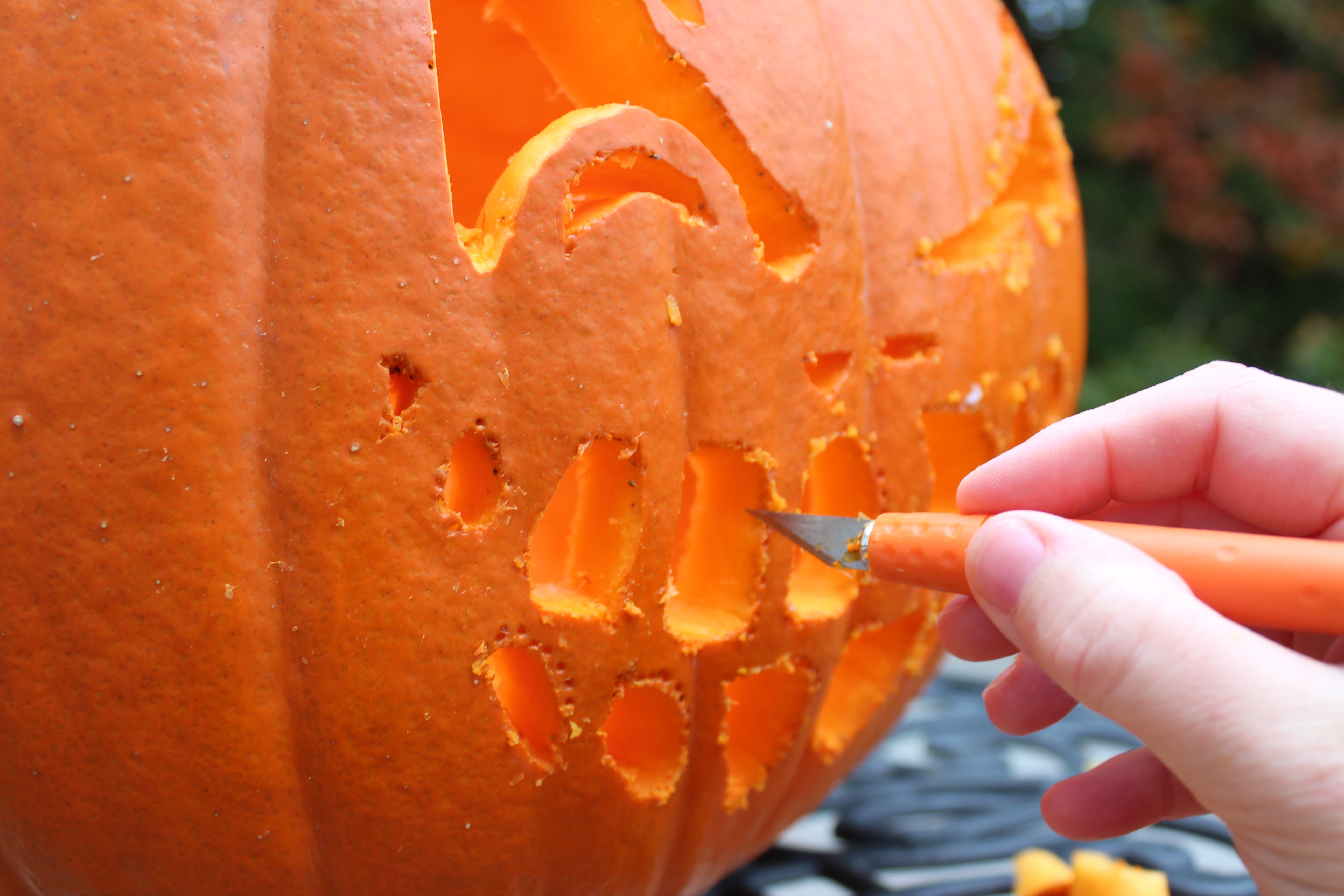 How do you carve a pumpkin? Cut out the face shapes