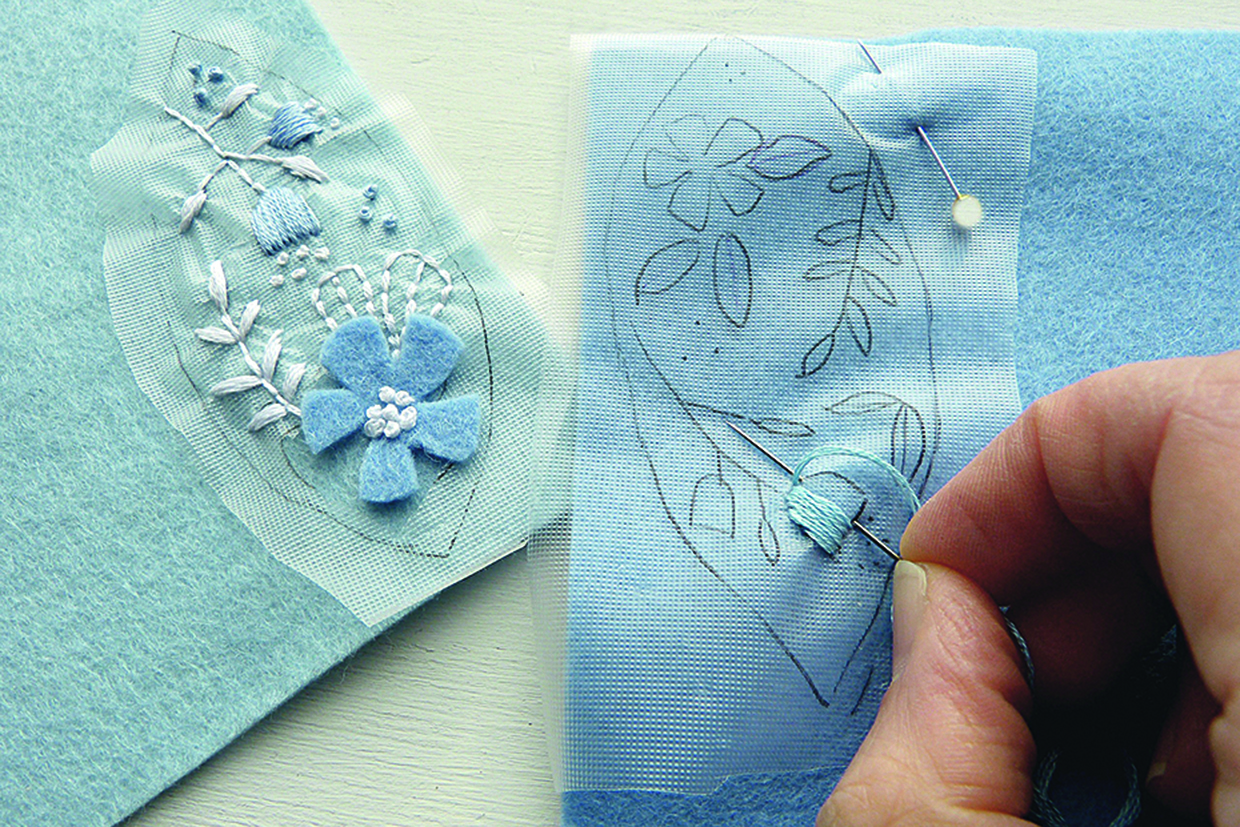 embroidering on felt eggs to add the petals in satin stitch