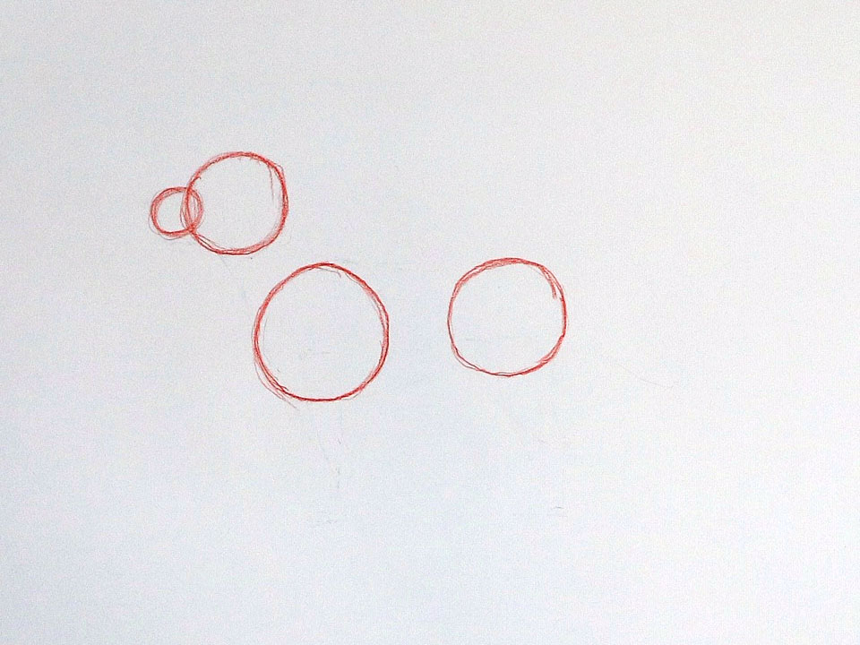 Draw overlapping circles to form the dog’s nose and muzzle