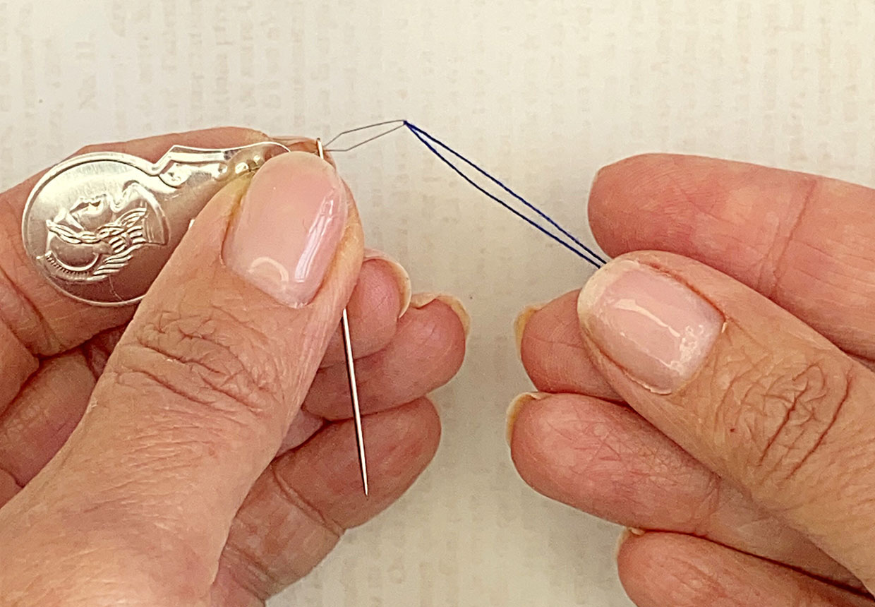 How to use a needle threader step 4