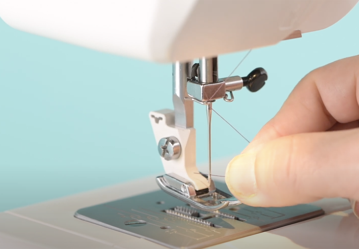How to thread a sewing machine needle