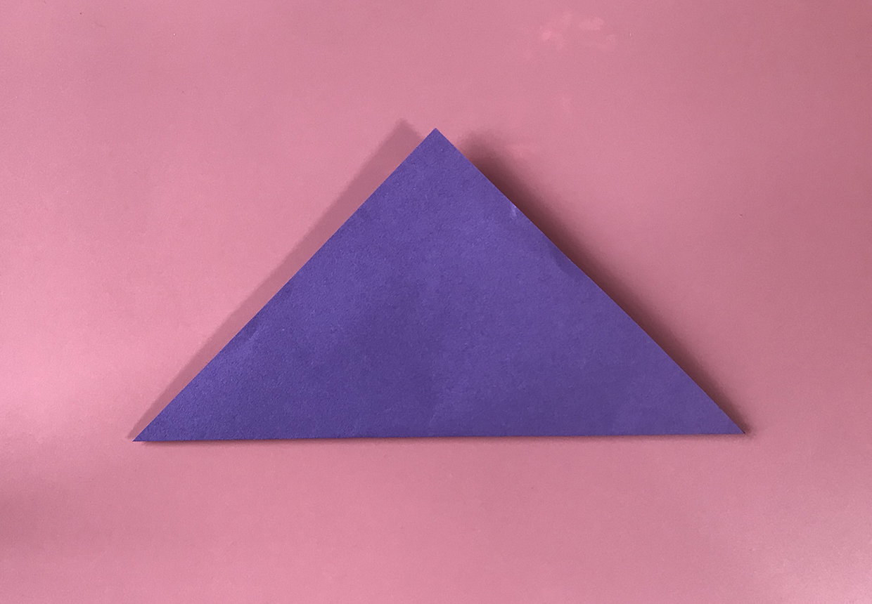 Fold a square of paper in half diagonally