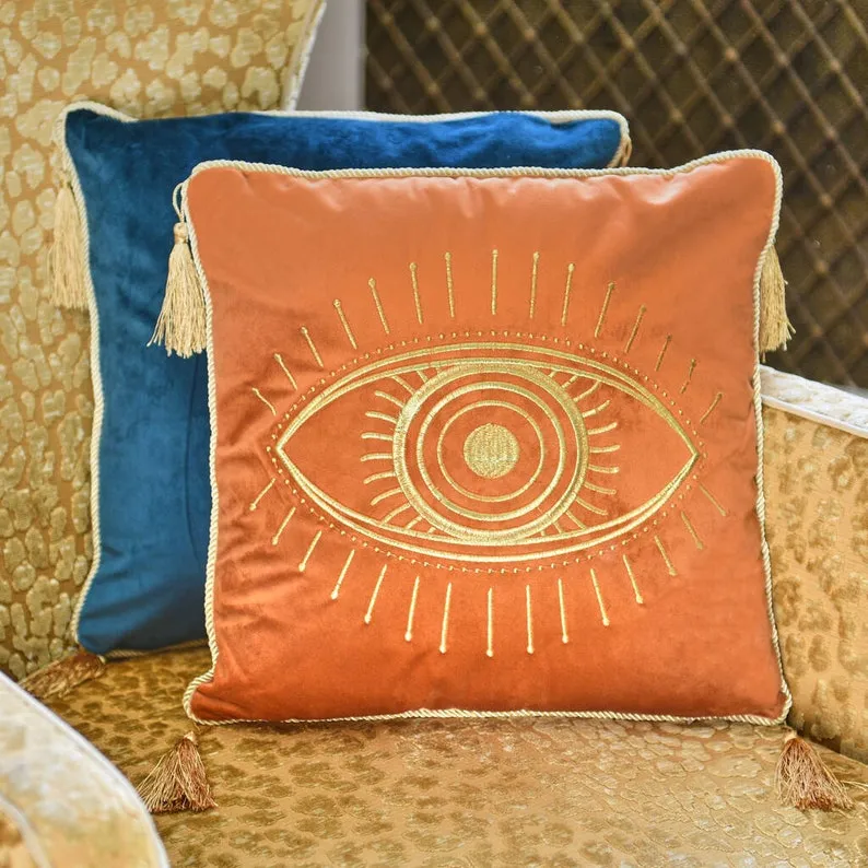 embroidered cushion with eye pattern