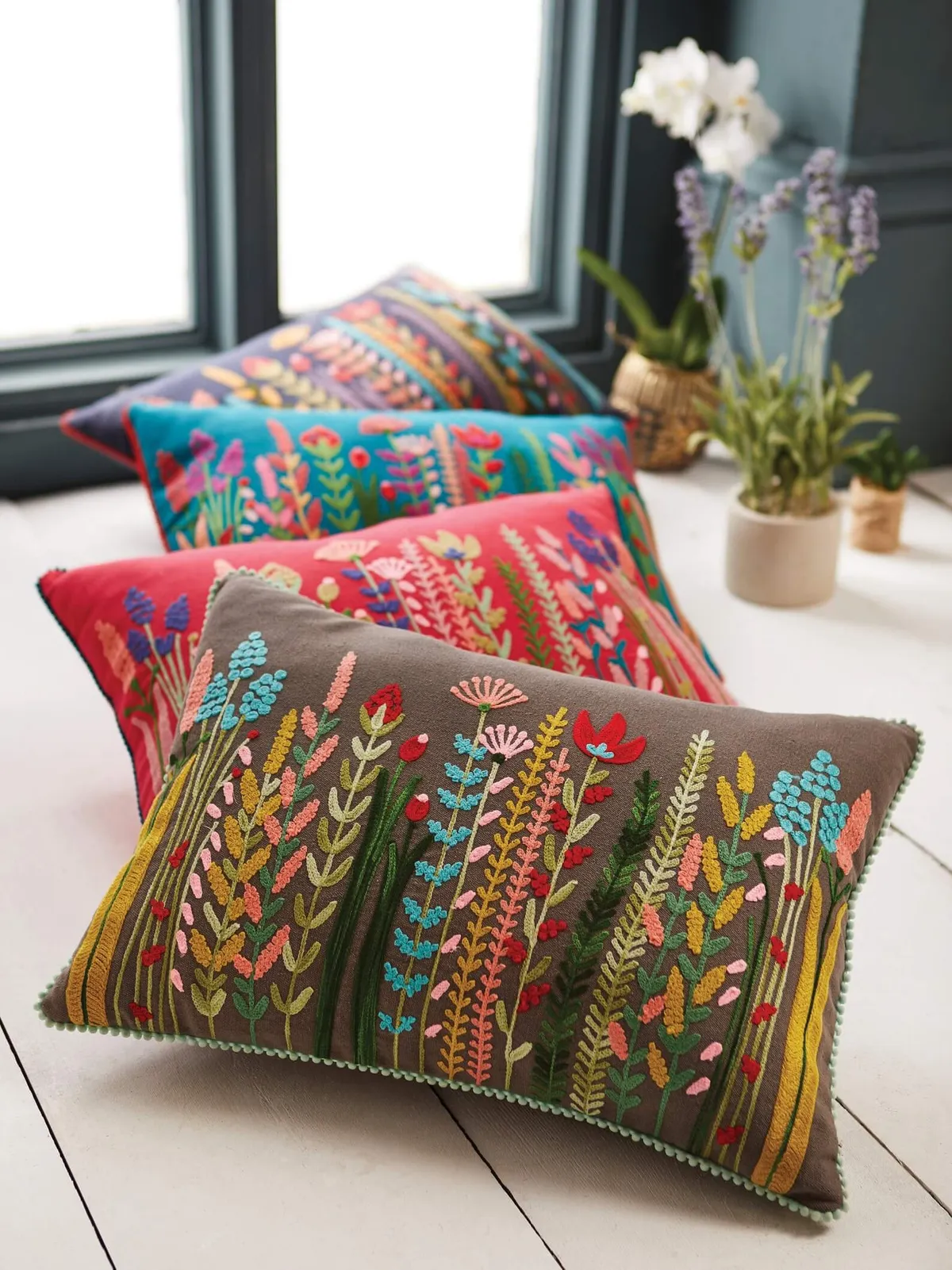 embroidered cushion with wildflower pattern