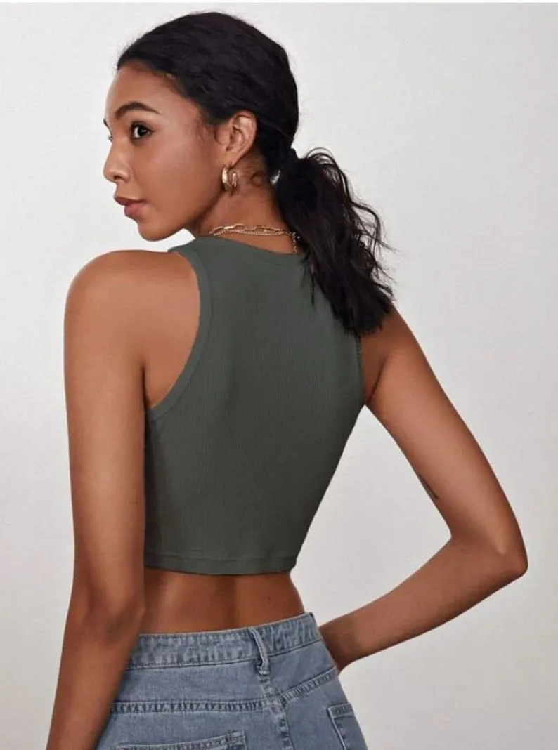 A person wearing a green crop top