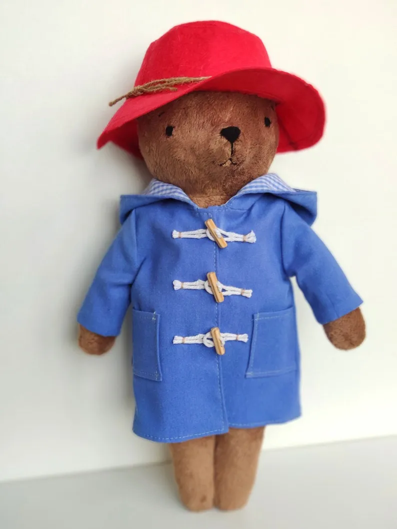Paddington Bear with a blue jacket and red hat