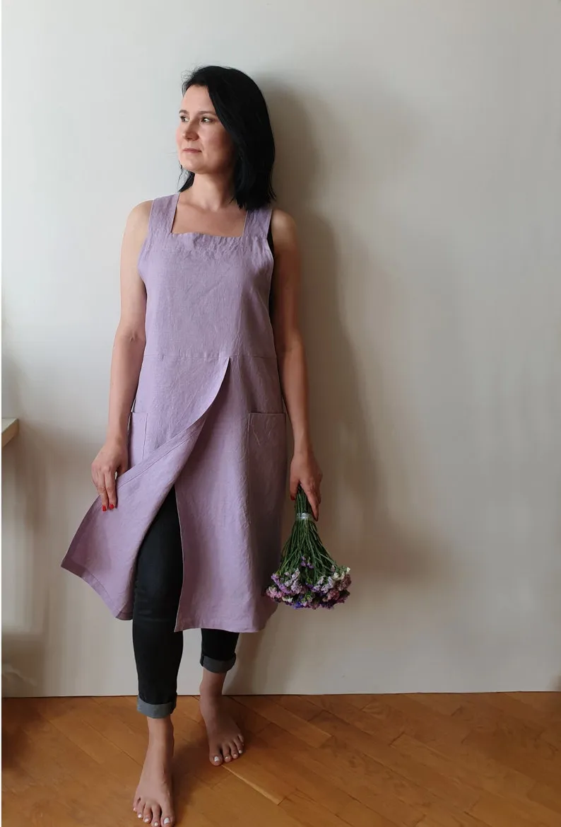 A purple apron that has been hand sewn