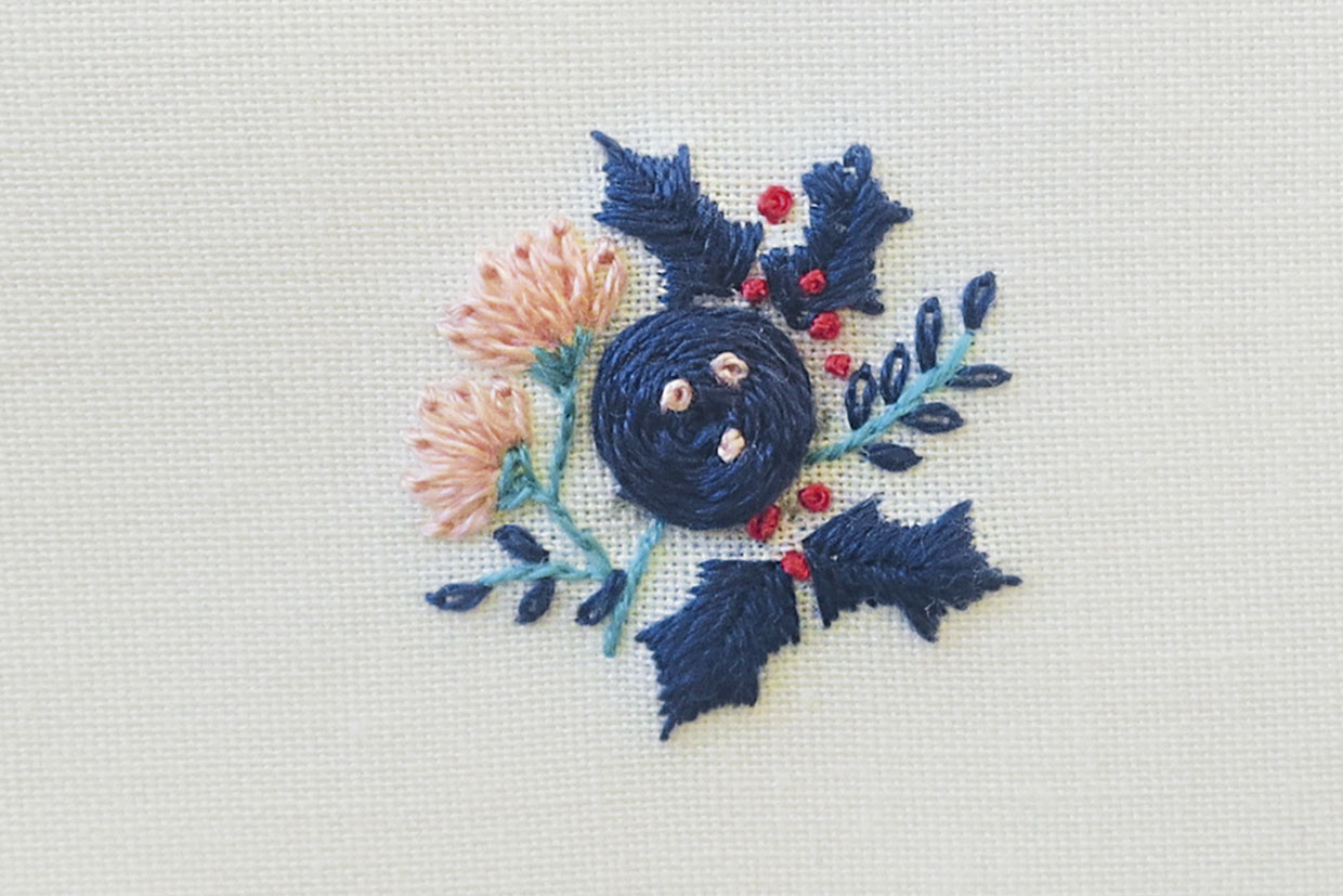 woven wheel stitch on a white fabric