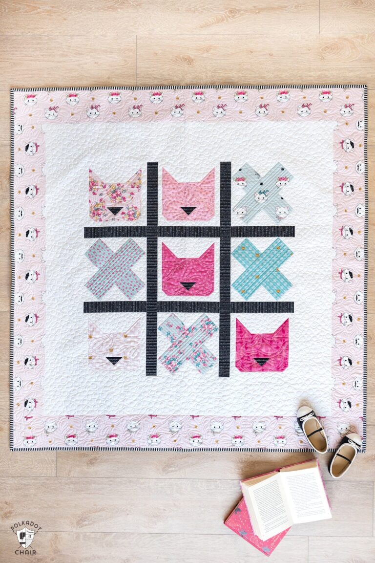 looking like a tic tac toe board this quilt has cat quilt books and crosses blocks