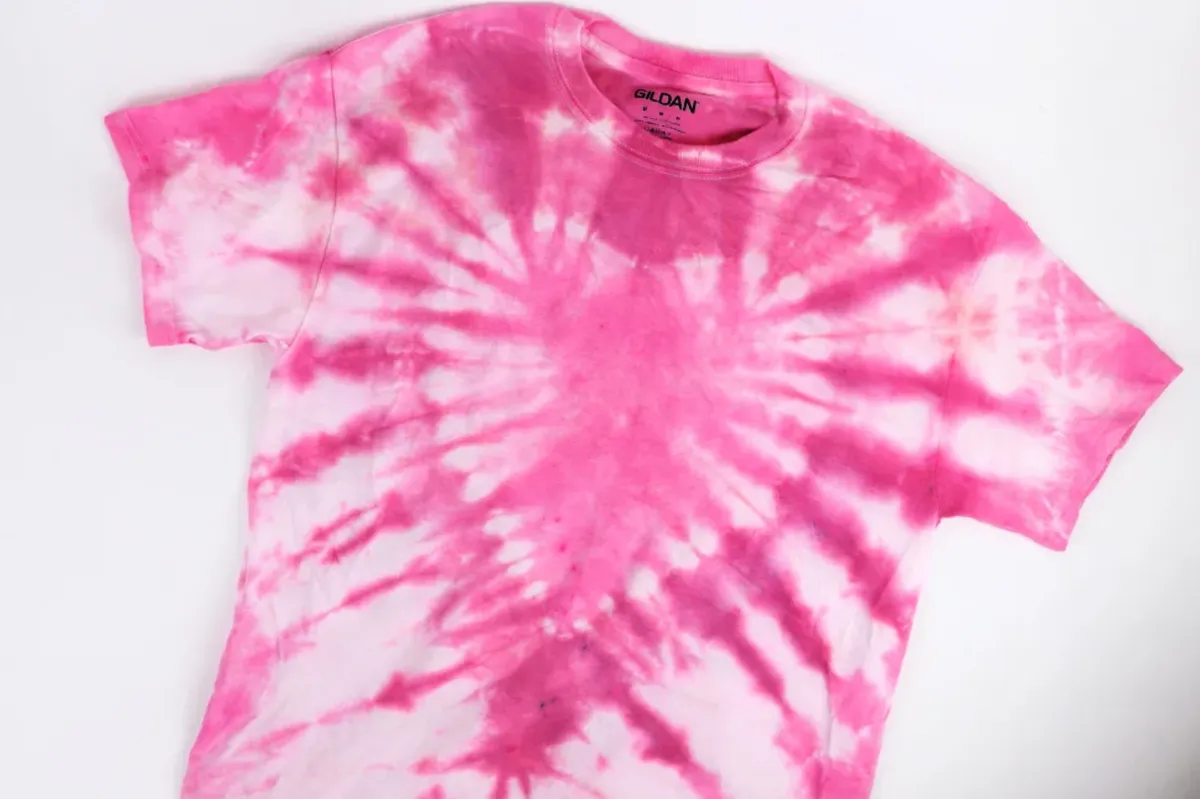 Pink tie dye shirt with a heart in the middle