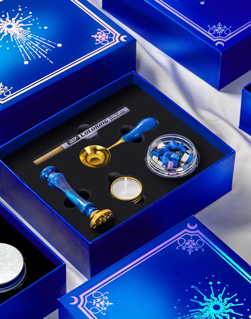 Live Life and World blue wax seal kit with spoon, candle, wax, pen and stamper inside