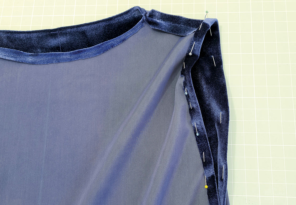 Pin then stitch the armhole seam allowance in place from the outside with a 5mm seam allowance