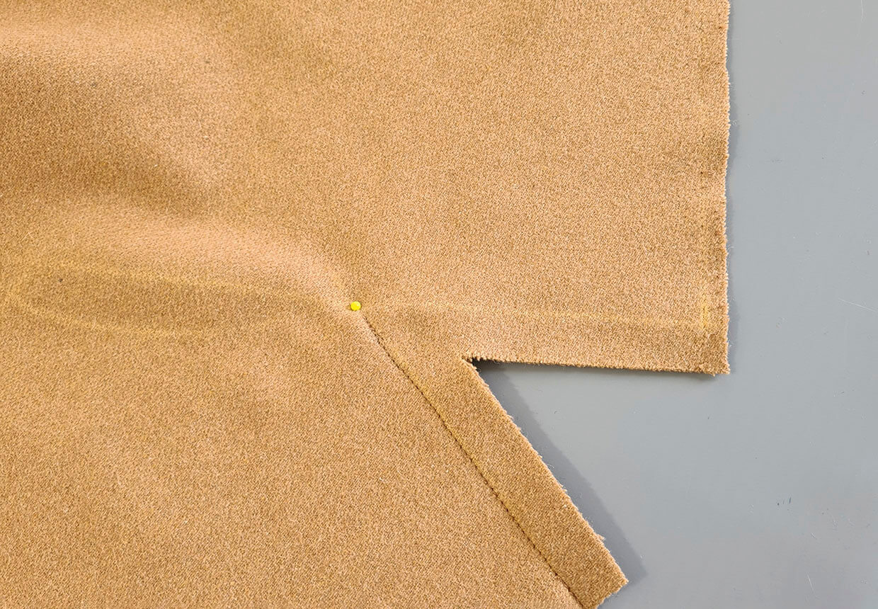 Starting from the marked shoulder/neck point, sew shoulder seams with the marked seam allowance. Backstitch at the beginning and the end of the seam