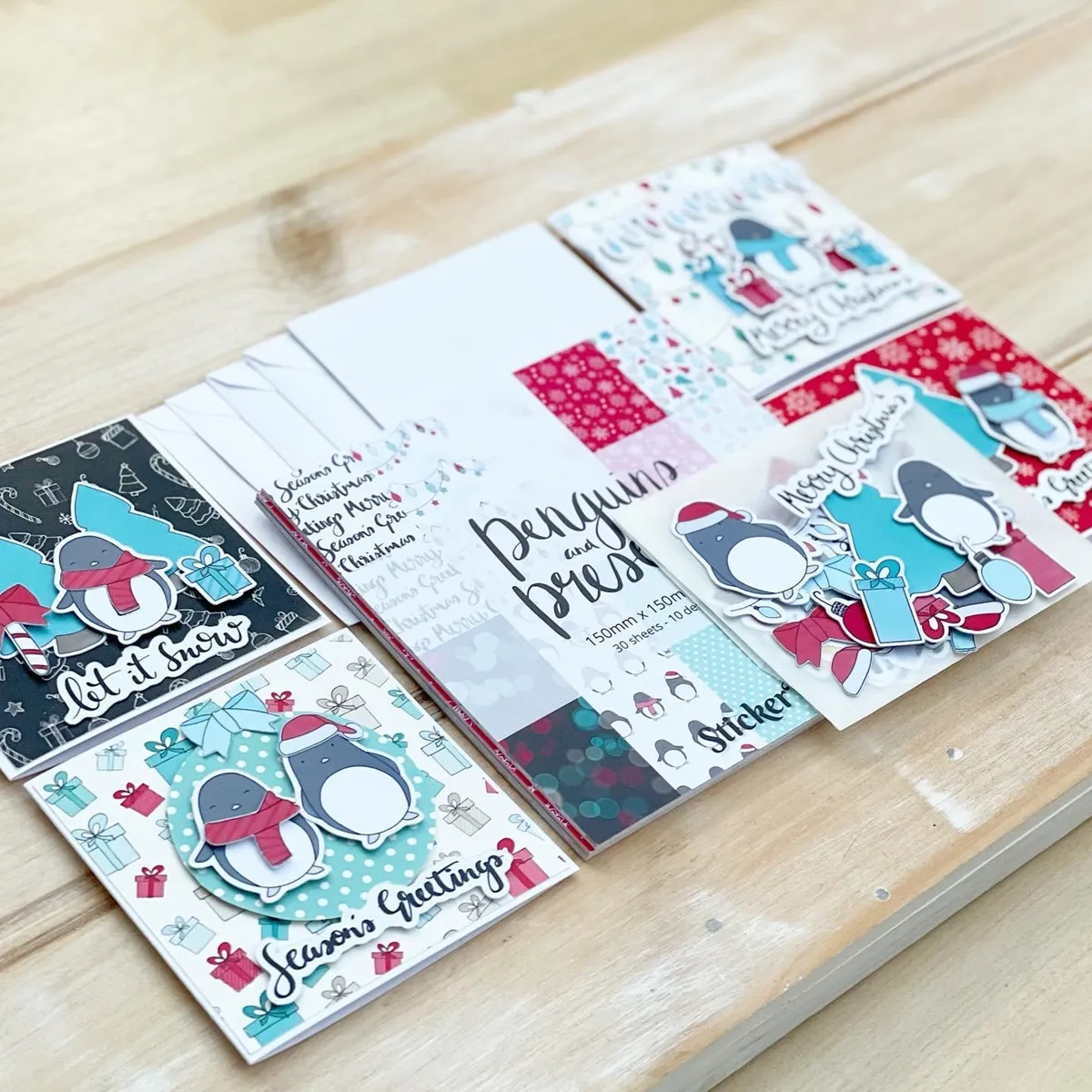 the Christmas card making kit comes with a riot of adorable penguin artwork for you to craft with