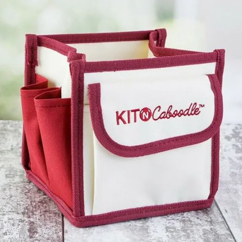 knitting bag from kitncaboodle is made of cream fabric with red trim and pockets