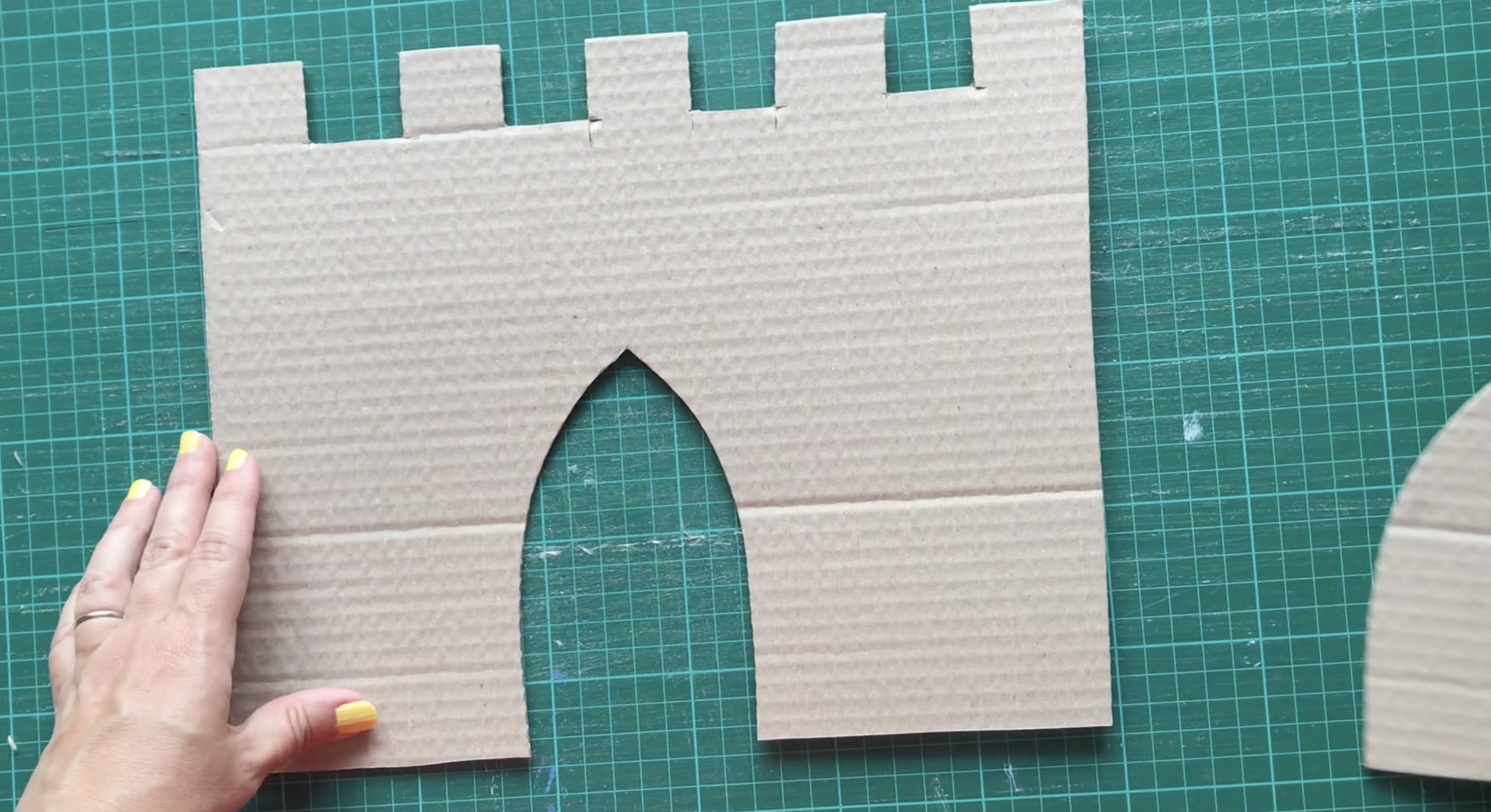 Cut a door shape from the bottom edge of the castle wall