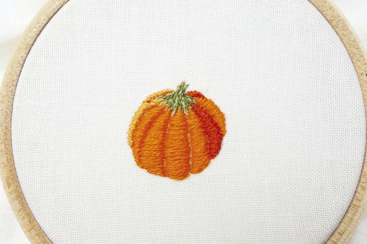 a completed embroidered pumpkin