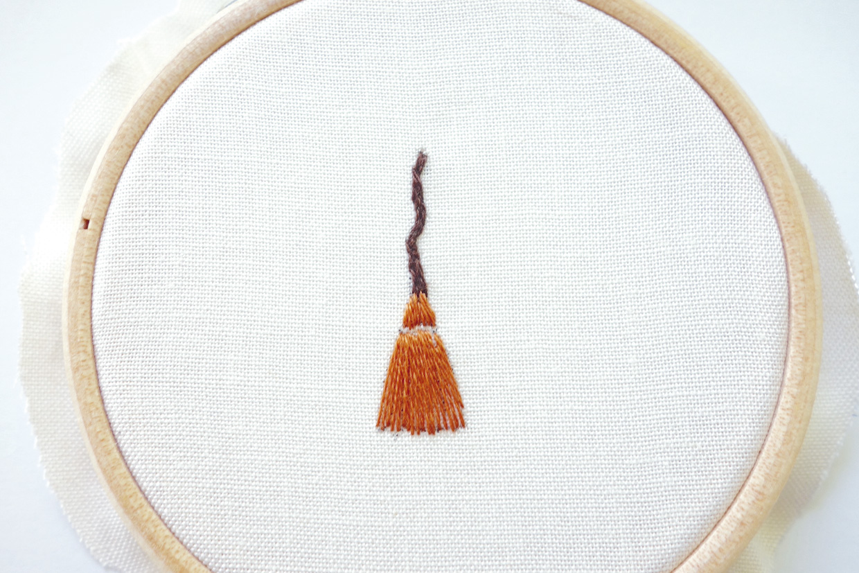 a witches broom partially embroidered