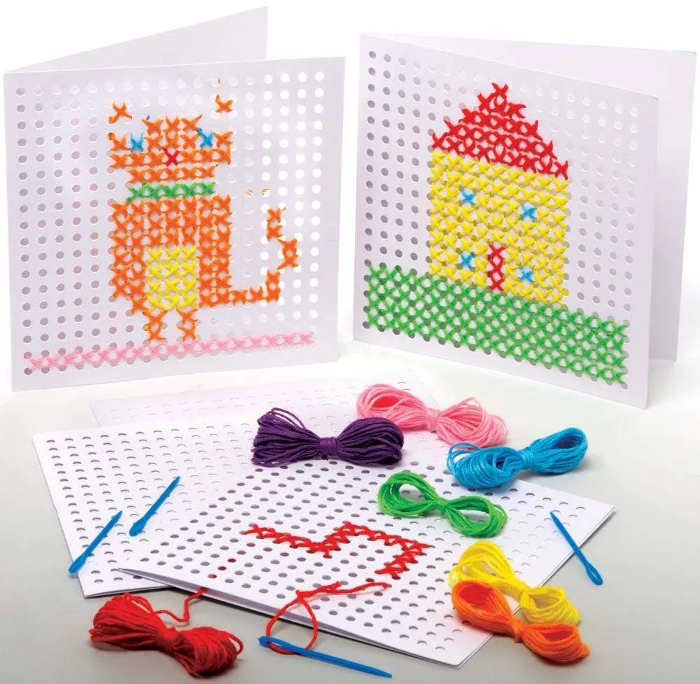 three cards with a grid of regular holes in the front have basic deigns of a cat and a house and the start of a tractor shape cross stitched on them